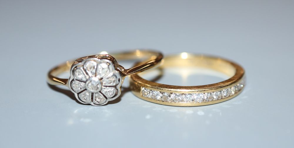 A modern 18ct gold and channel set diamond half eternity ring, size N and an earlier 18ct and diamond chip set ring.